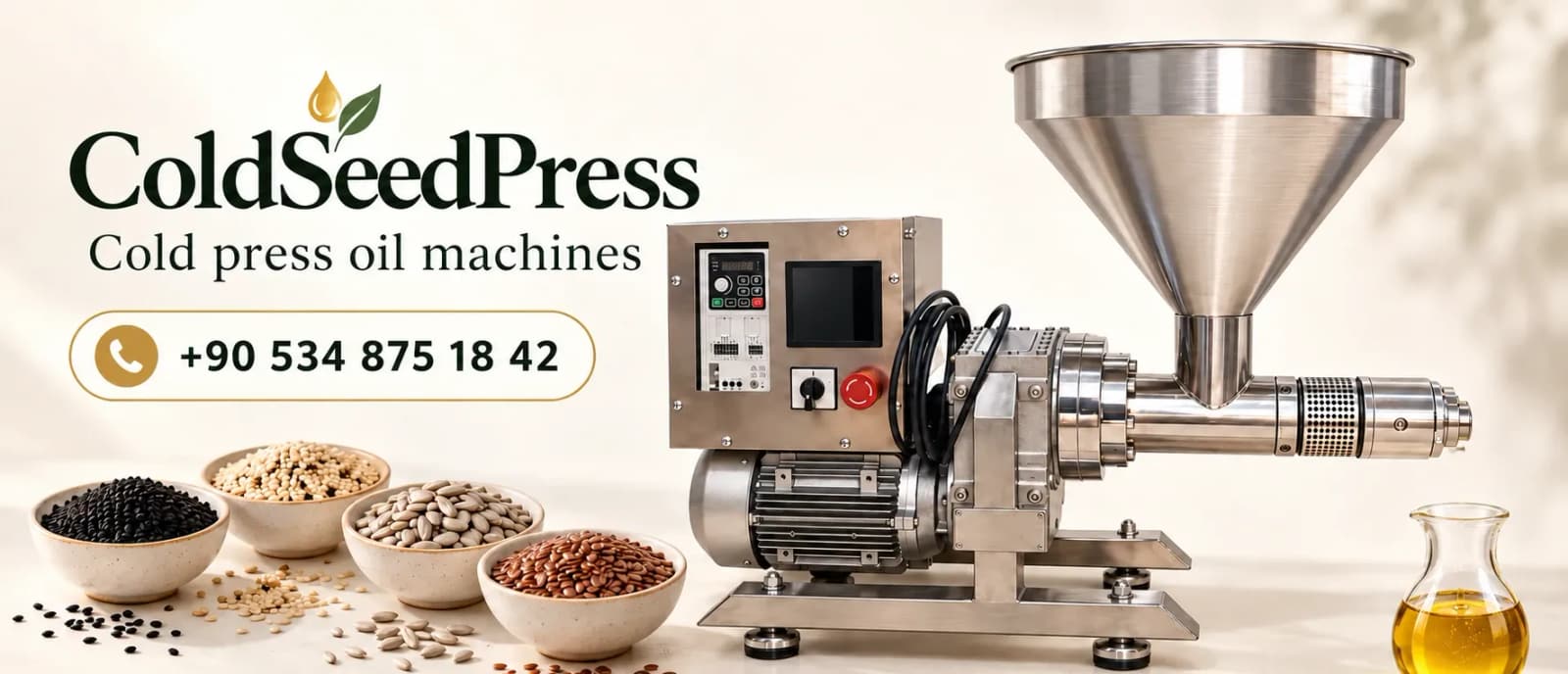 Cold press oil machines with brand signage in a production hall